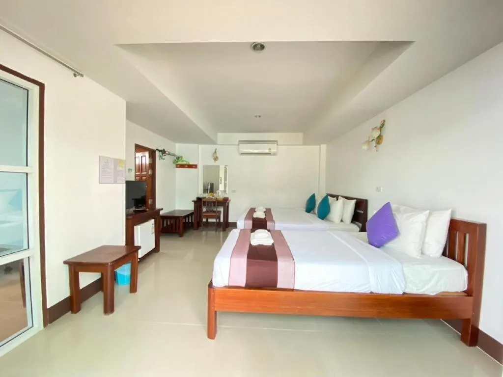 Bed in Rattana Pura Beach Resort