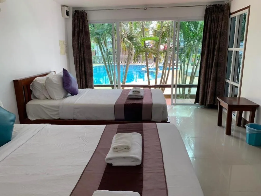 Bed in Rattana Pura Beach Resort