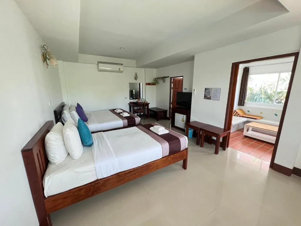 Bed in Rattana Pura Beach Resort
