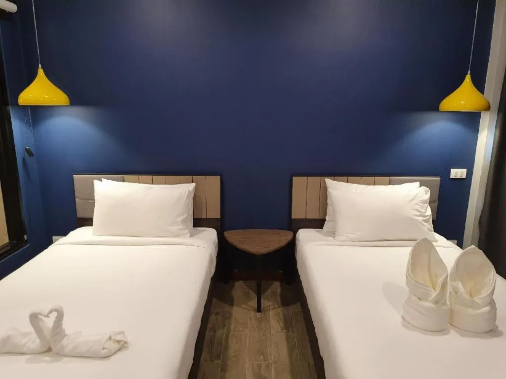 Bed in THE S VILLAS HOTEL