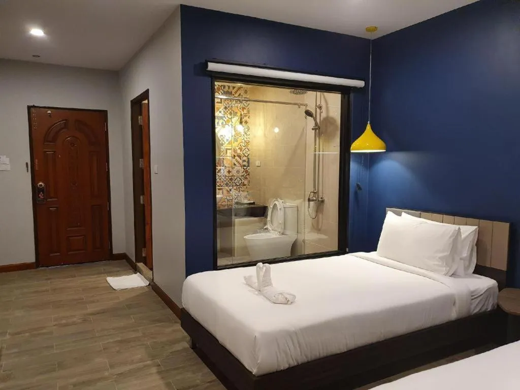 Bed in THE S VILLAS HOTEL