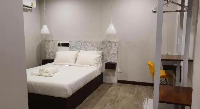 Bed in THE S VILLAS HOTEL