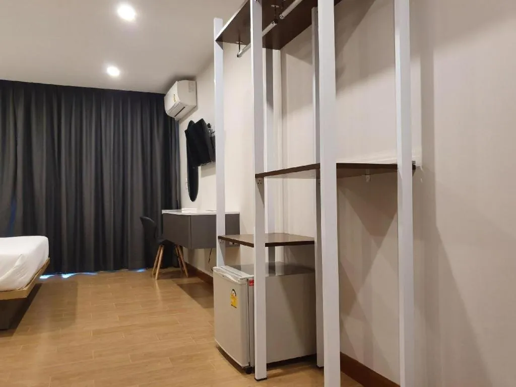 Bed in THE S VILLAS HOTEL