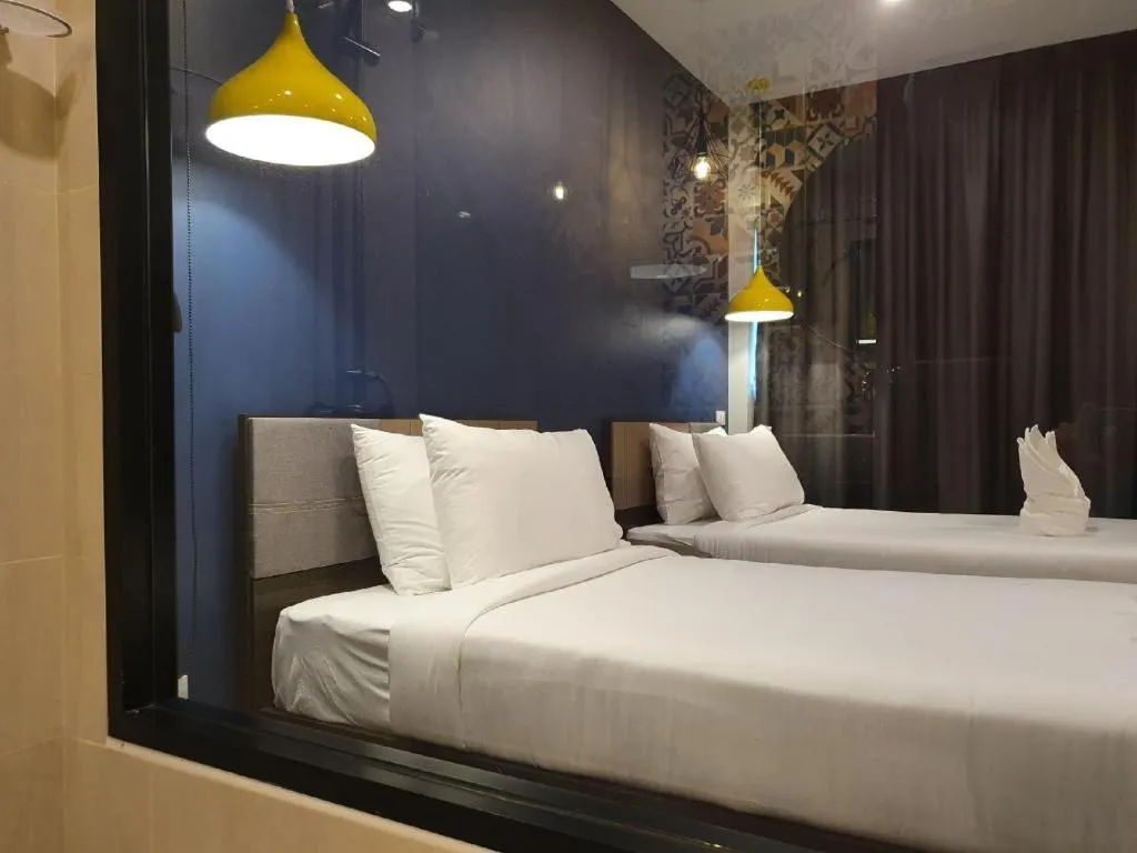 Bed in THE S VILLAS HOTEL