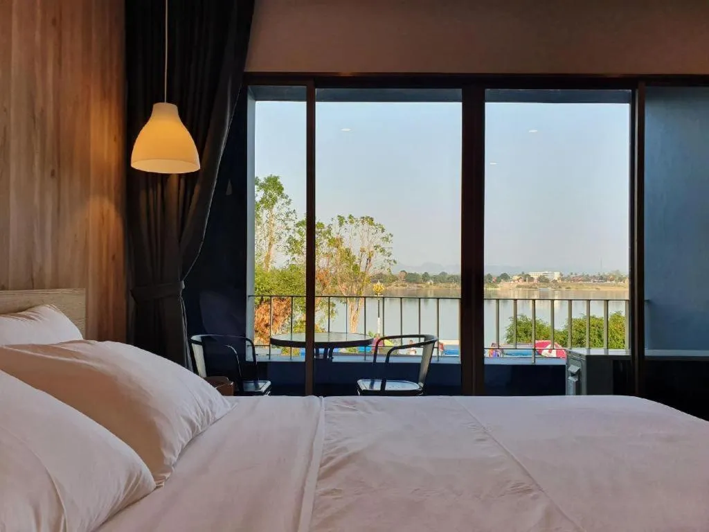 Bed in THE S VILLAS HOTEL