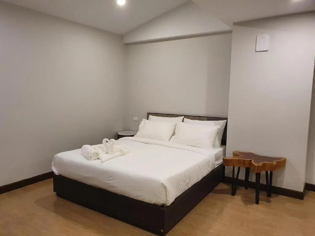 Bed in THE S VILLAS HOTEL