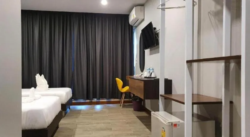 Bed in THE S VILLAS HOTEL