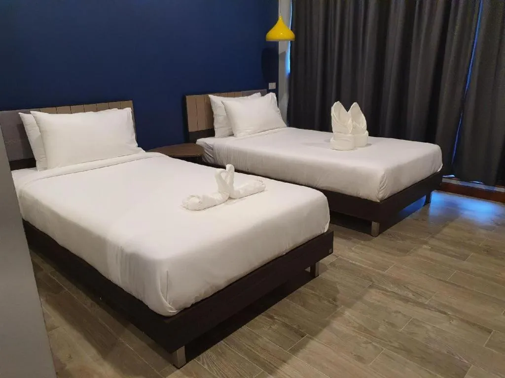 Bed in THE S VILLAS HOTEL