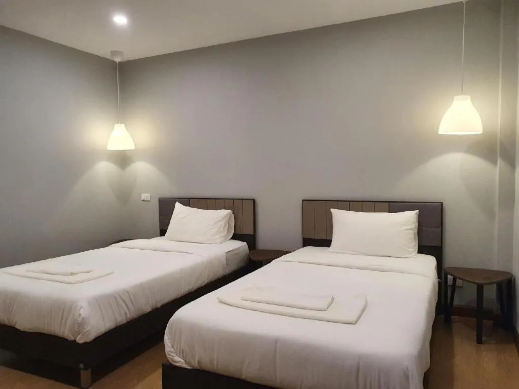 Bed in THE S VILLAS HOTEL