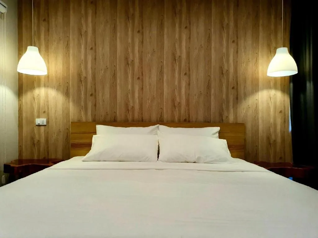 Bed in THE S VILLAS HOTEL