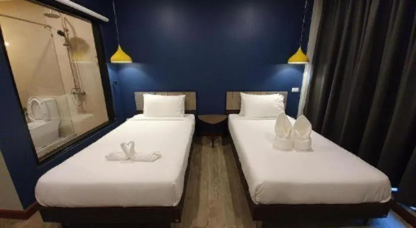 Bed in THE S VILLAS HOTEL