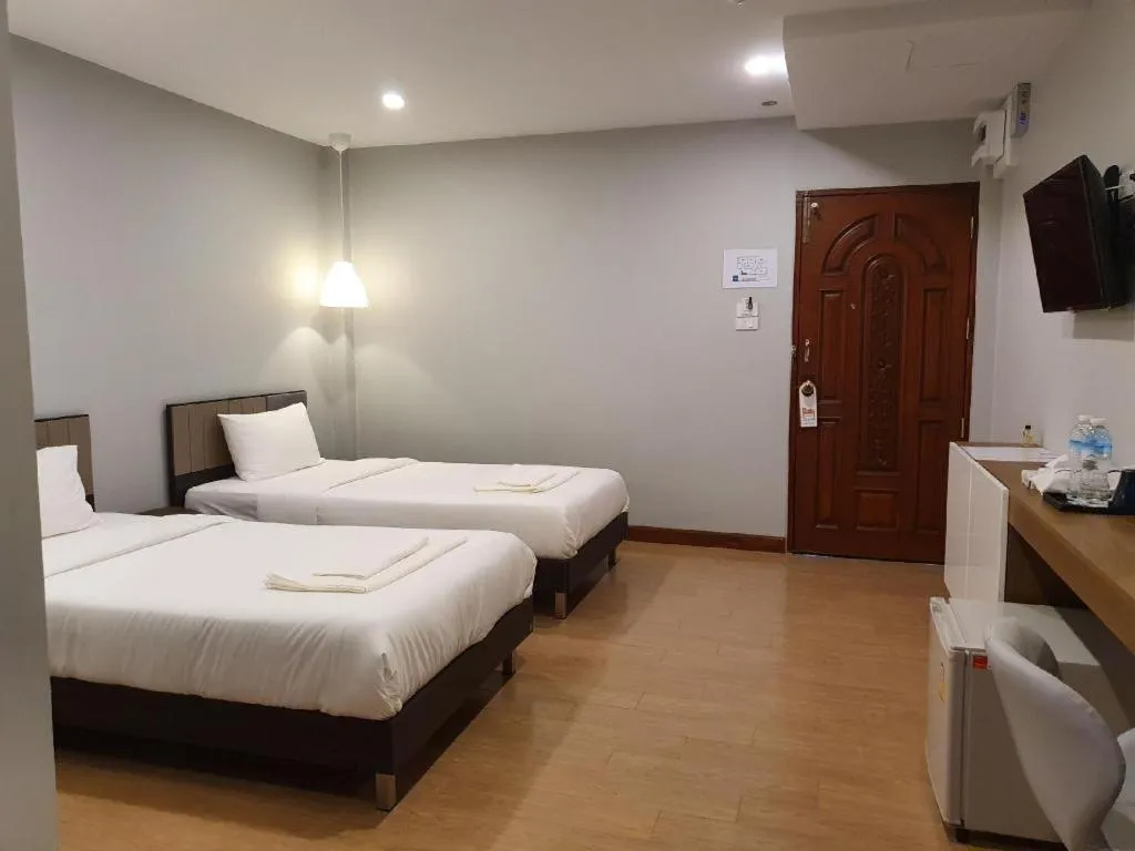 Bed in THE S VILLAS HOTEL