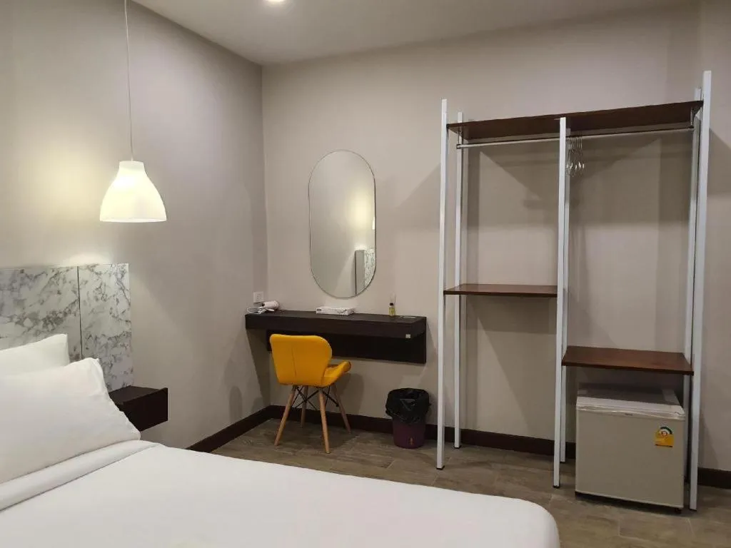 Bed in THE S VILLAS HOTEL