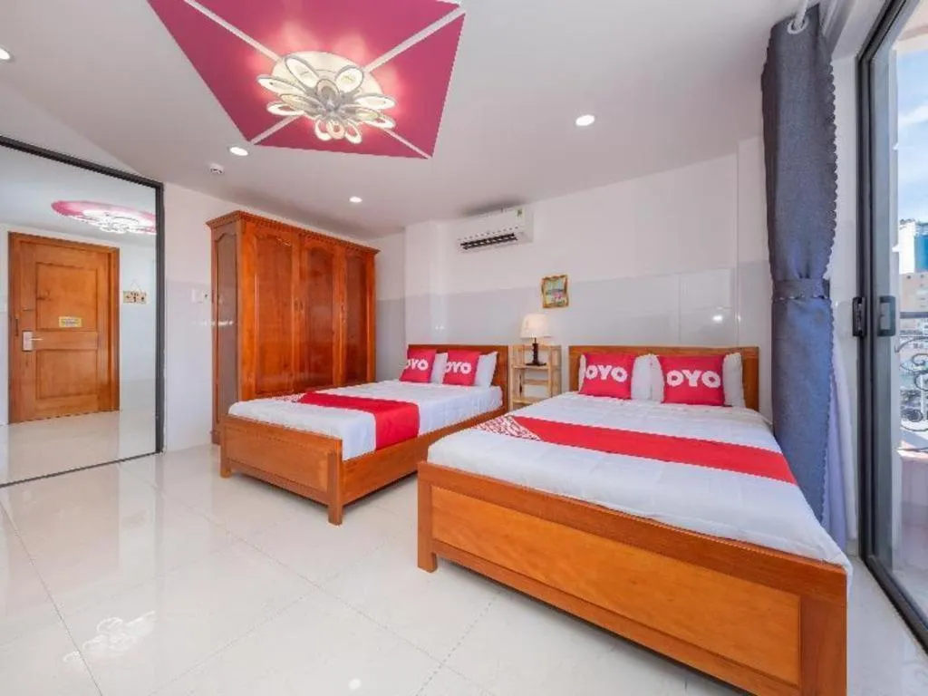 Bed in OYO 1028 Flower House Apartment