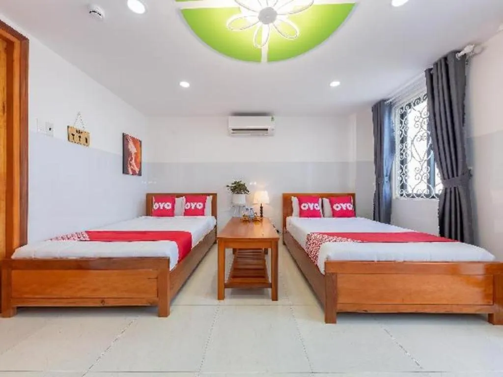 Bed in OYO 1028 Flower House Apartment