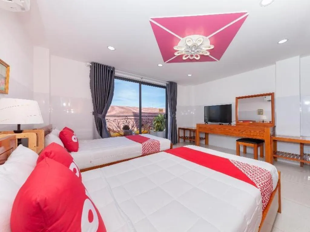 Bed in OYO 1028 Flower House Apartment