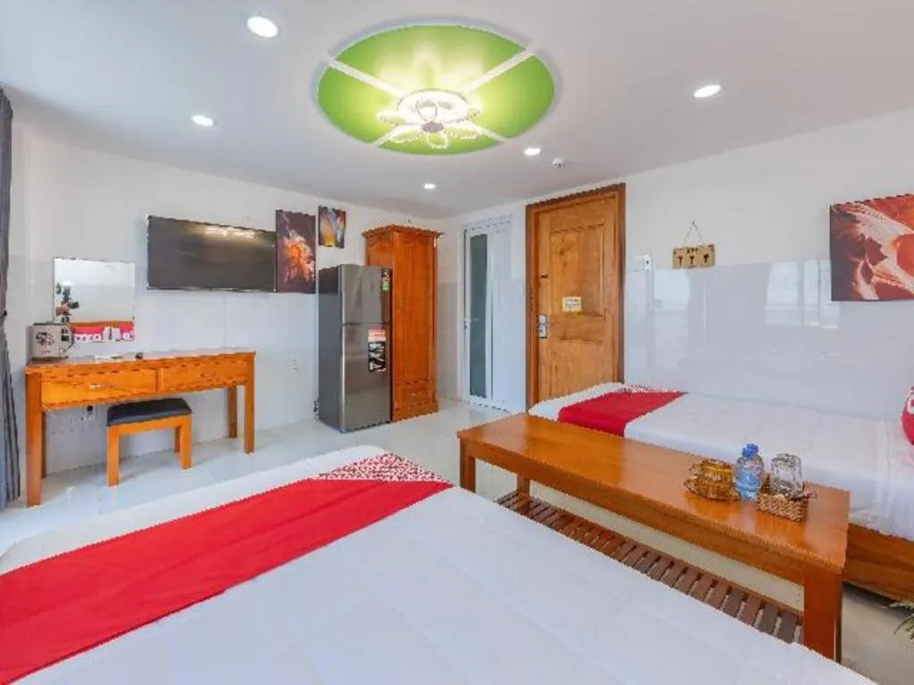 Bed in OYO 1028 Flower House Apartment