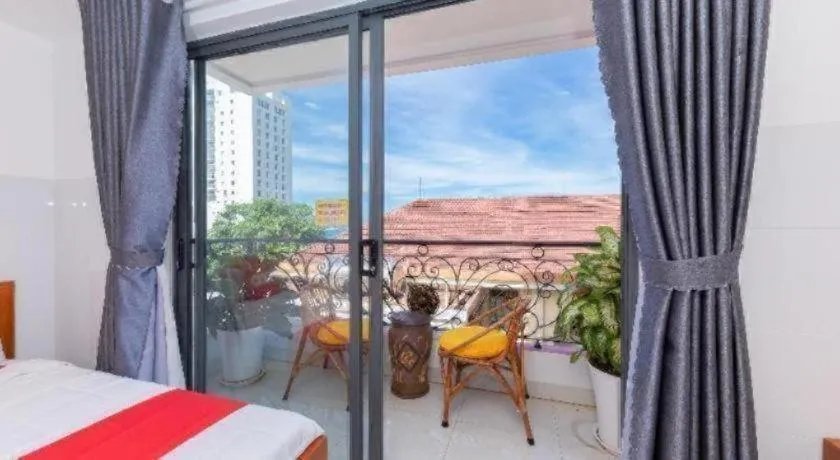 Bed in OYO 1028 Flower House Apartment