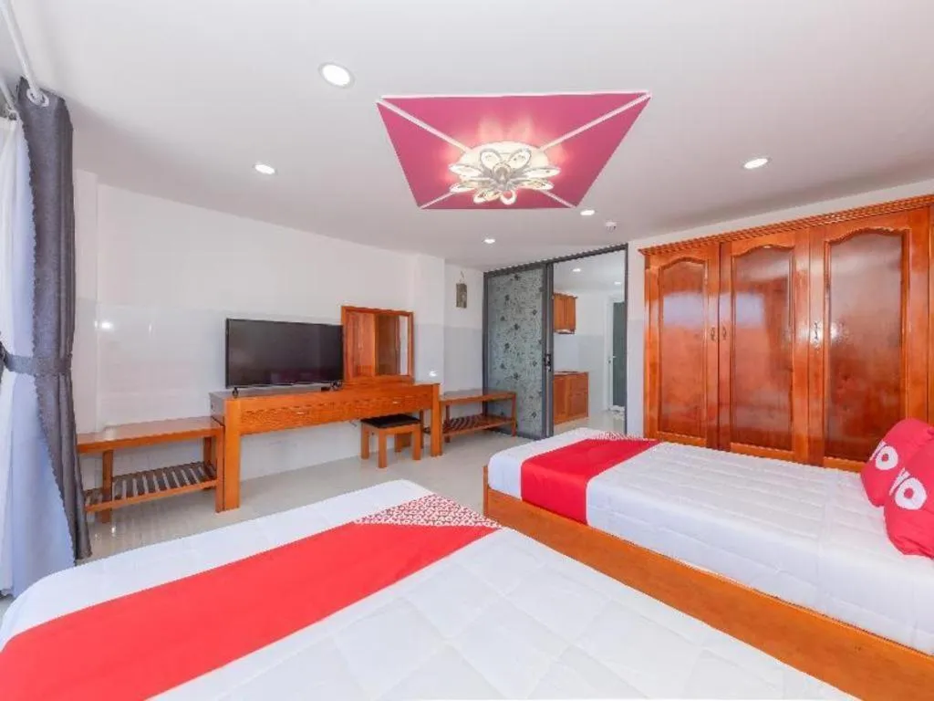 Bed in OYO 1028 Flower House Apartment