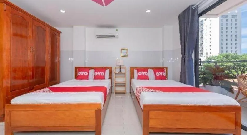 Bed in OYO 1028 Flower House Apartment