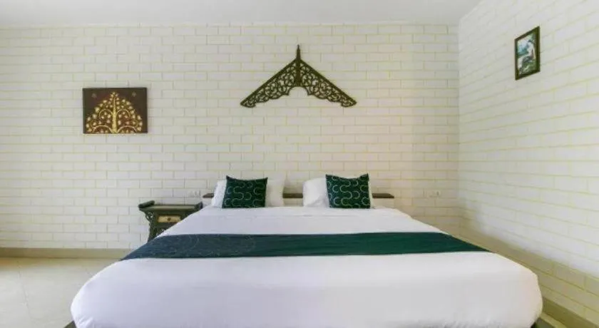 Bed in CAPITAL O961 Baan Dow Chompoo Resort