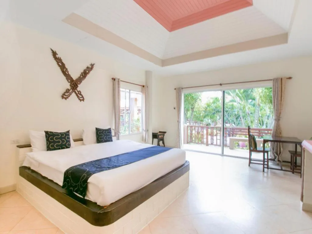 Bed in CAPITAL O961 Baan Dow Chompoo Resort