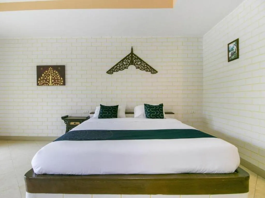 Bed in CAPITAL O961 Baan Dow Chompoo Resort
