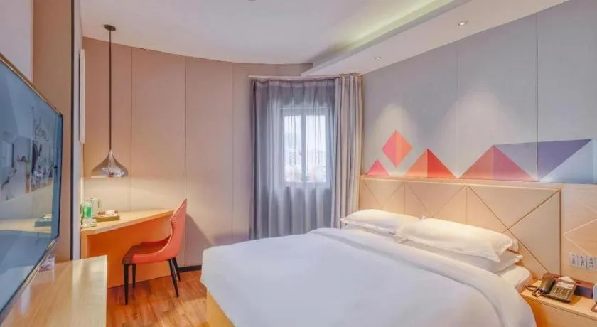 Bed in Borrman Hotel Zhaoqing Sihui Tianguangxu Jade City