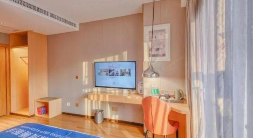 Bed in Borrman Hotel Zhaoqing Sihui Tianguangxu Jade City