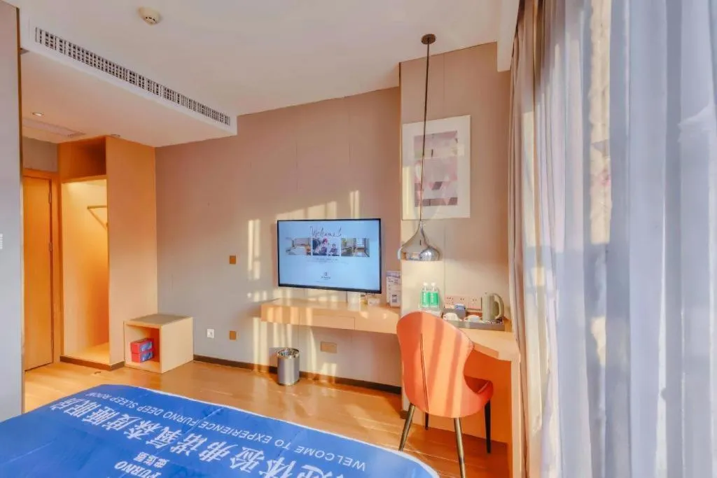 Bed in Borrman Hotel Zhaoqing Sihui Tianguangxu Jade City