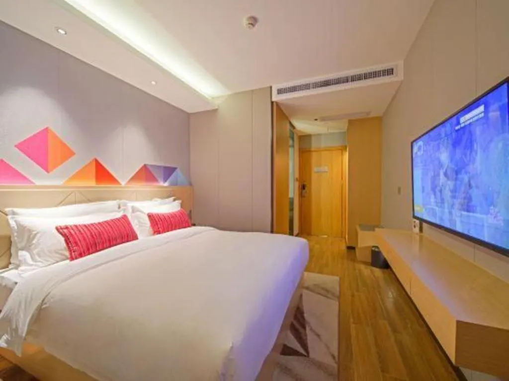 Bed in Borrman Hotel Zhaoqing Sihui Tianguangxu Jade City