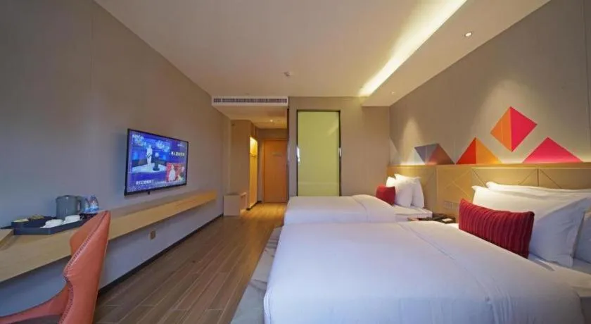 Bed in Borrman Hotel Zhaoqing Sihui Tianguangxu Jade City