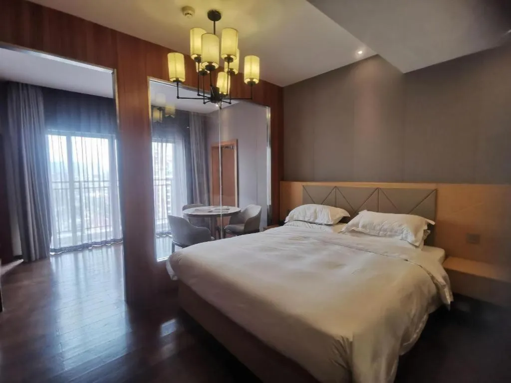 Bed in Borrman Hotel Zhaoqing Sihui Tianguangxu Jade City