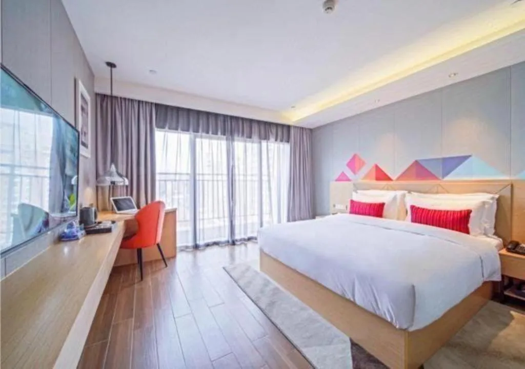 Bed in Borrman Hotel Zhaoqing Sihui Tianguangxu Jade City