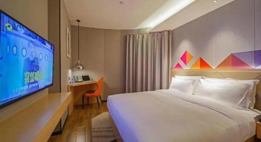 Bed in Borrman Hotel Zhaoqing Sihui Tianguangxu Jade City