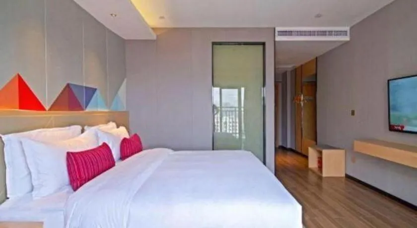 Bed in Borrman Hotel Zhaoqing Sihui Tianguangxu Jade City