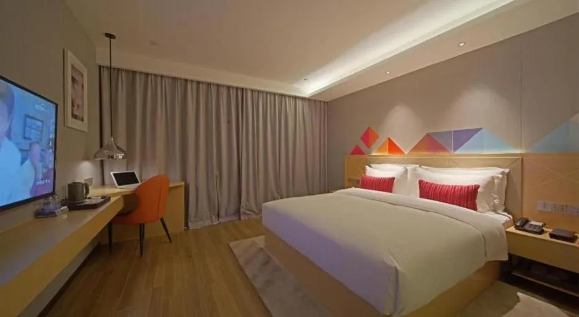 Bed in Borrman Hotel Zhaoqing Sihui Tianguangxu Jade City