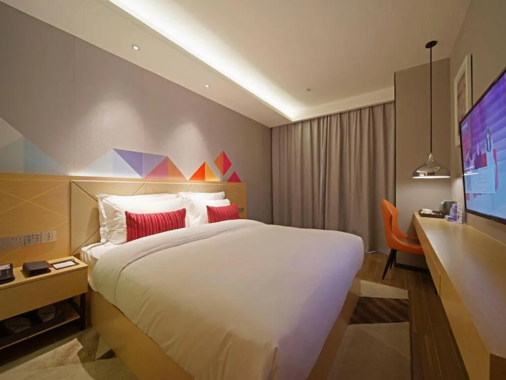 Bed in Borrman Hotel Zhaoqing Sihui Tianguangxu Jade City