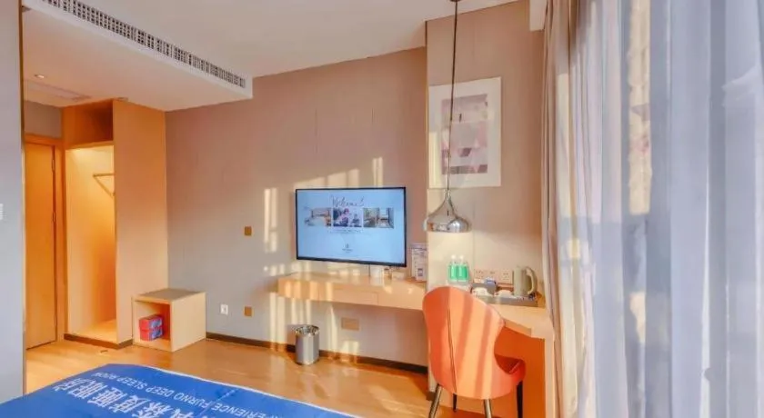 Bed in Borrman Hotel Zhaoqing Sihui Tianguangxu Jade City