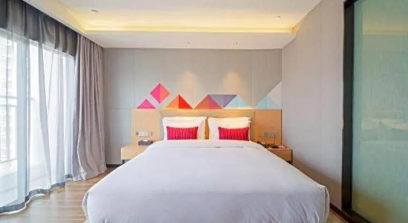 Bed in Borrman Hotel Zhaoqing Sihui Tianguangxu Jade City