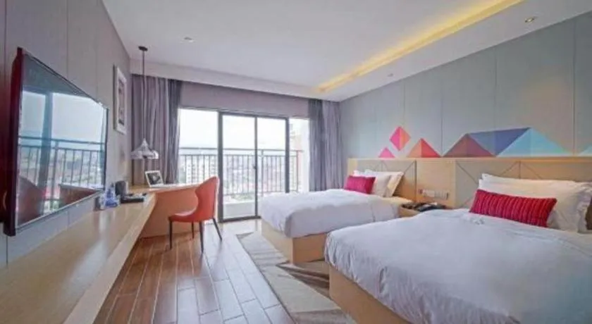 Bed in Borrman Hotel Zhaoqing Sihui Tianguangxu Jade City