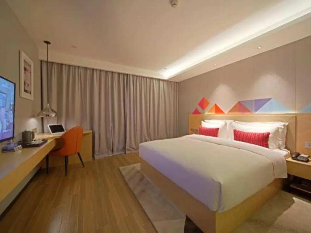 Bed in Borrman Hotel Zhaoqing Sihui Tianguangxu Jade City