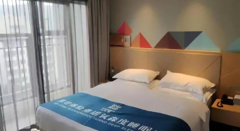 Bed in Borrman Hotel Zhaoqing Sihui Tianguangxu Jade City