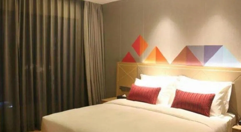 Bed in Borrman Hotel Zhaoqing Sihui Tianguangxu Jade City