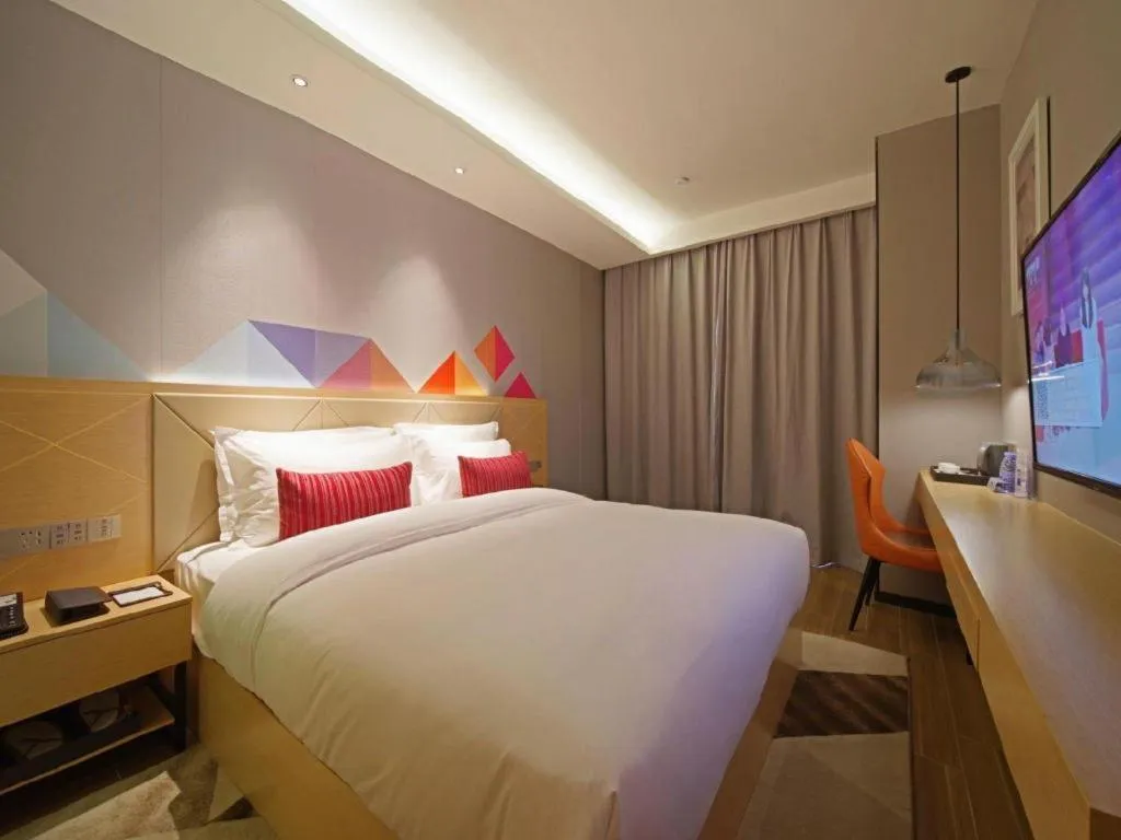 Bed in Borrman Hotel Zhaoqing Sihui Tianguangxu Jade City