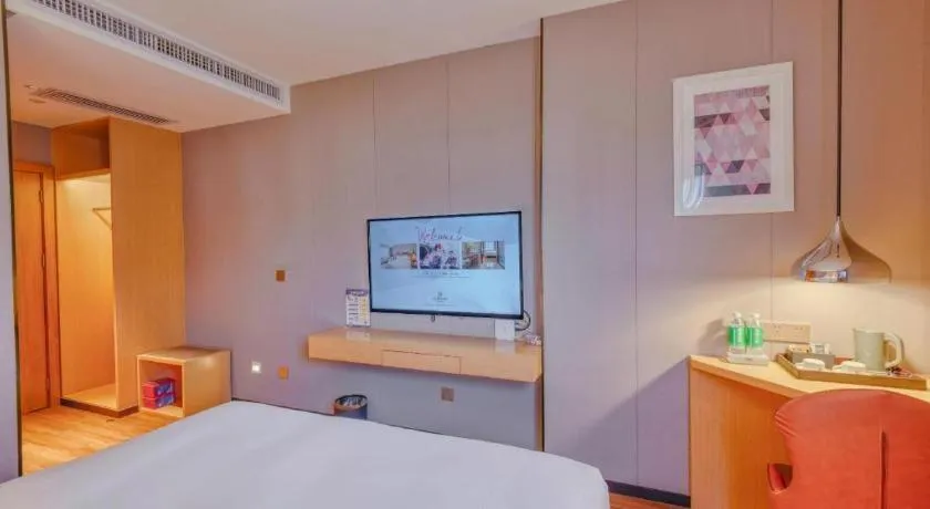 Bed in Borrman Hotel Zhaoqing Sihui Tianguangxu Jade City