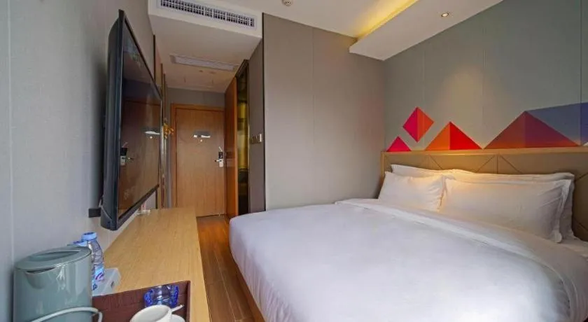 Bed in Borrman Hotel Zhaoqing Sihui Tianguangxu Jade City