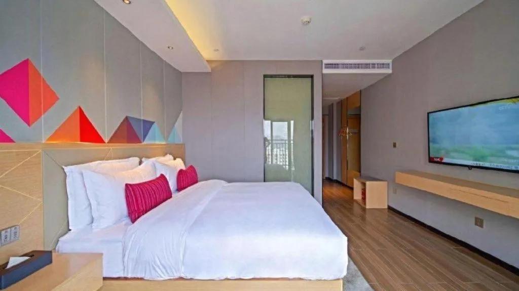 Bed in Borrman Hotel Zhaoqing Sihui Tianguangxu Jade City