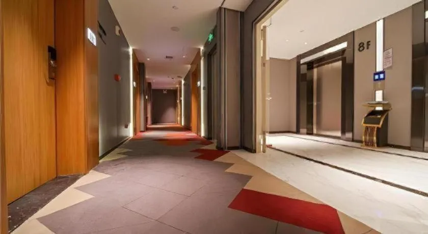 Bed in Borrman Hotel Zhaoqing Sihui Tianguangxu Jade City