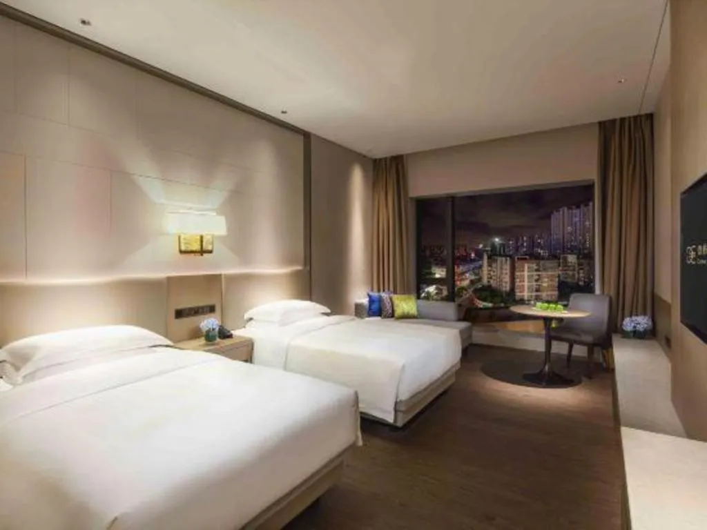 Bed in Derayco Hotel Foshan